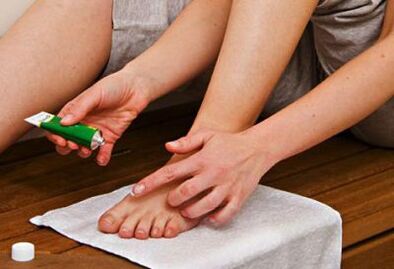 apply ointment to treat nail fungus